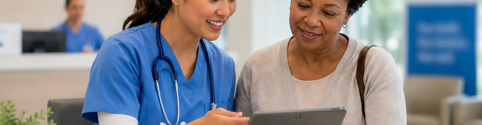 Advanced practice provider helping a patient review healthcare information on a tablet in a modern clinic, illustrating technology-supported patient engagement and communication.